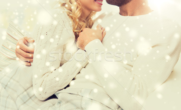 close up of happy couple cuddling at home Stock photo © dolgachov
