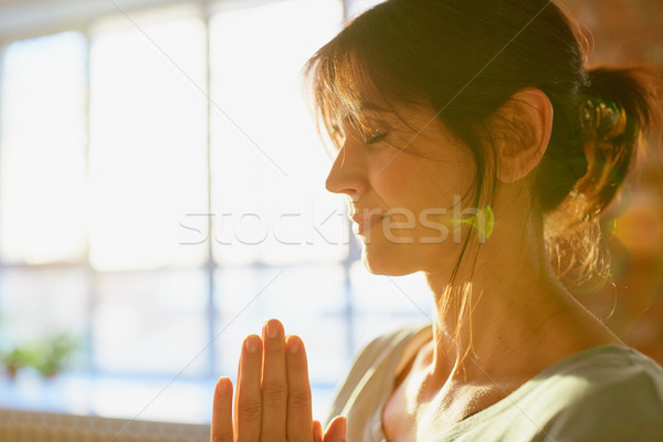 close up of yogi woman meditating at yoga studio Stock photo © dolgachov