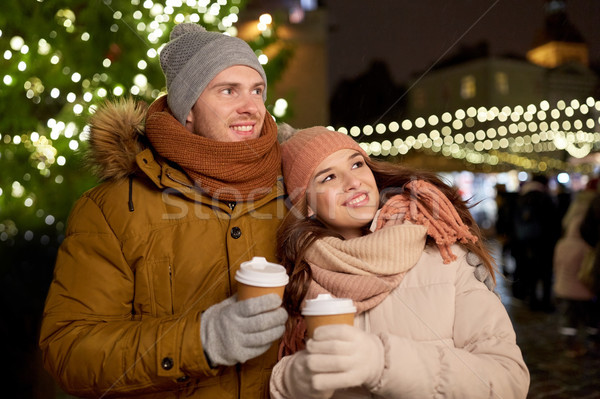happy young couple with coffee at christmas market Stock photo © dolgachov