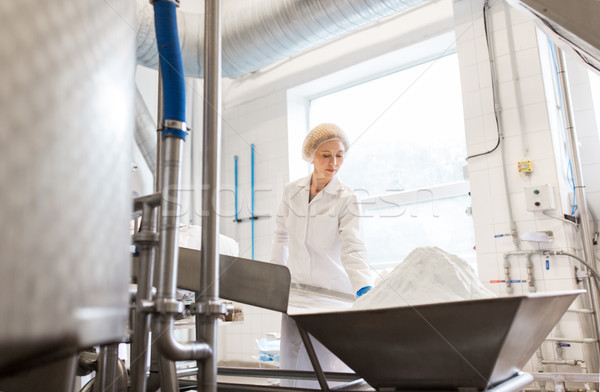 woman working at ice cream factory conveyor Stock photo © dolgachov