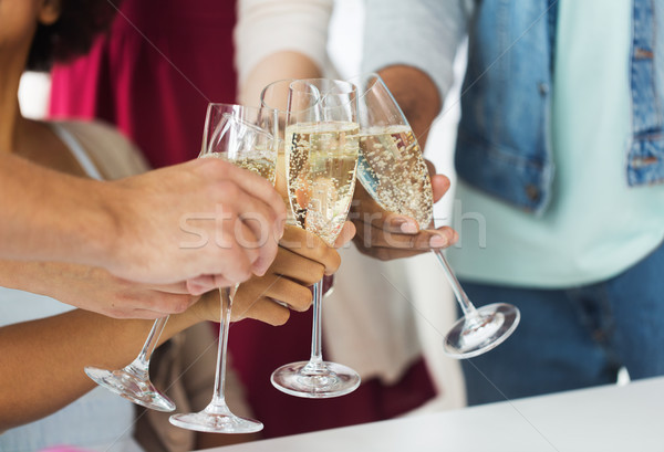 Stock photo: friends clinking glasses of champagne at party