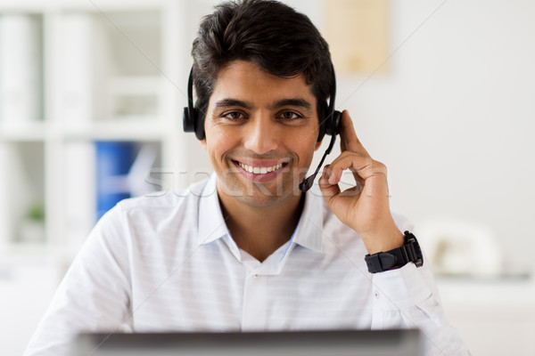 Stock photo: businessman with headset and computer at office