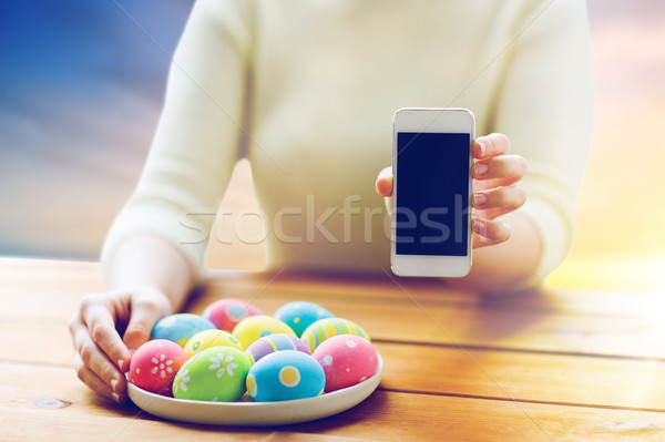 Handen paaseieren smartphone Pasen religieuze Stockfoto © dolgachov