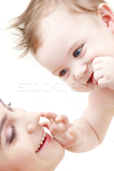 happy blue-eyed baby boy touching mama Stock photo © dolgachov