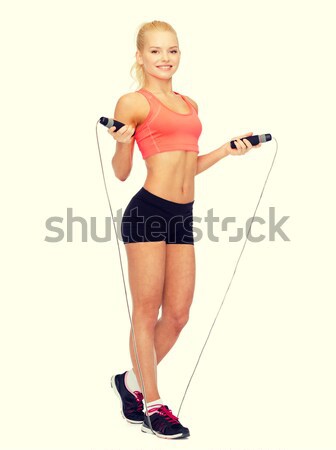 Stock photo: muscular fitness instructor with dumbbells