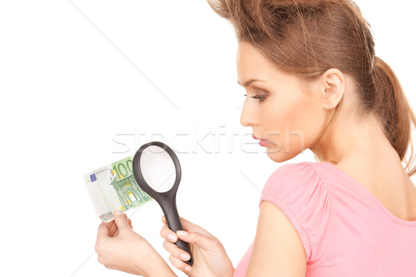 woman with magnifying glass and money Stock photo © dolgachov
