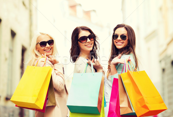 Stock photo: girls with shopping bags in ctiy