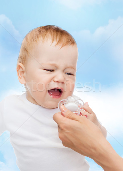 crying baby with dummy Stock photo © dolgachov