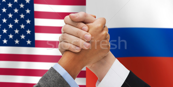 Handen amerikaanse russisch vlaggen politiek Stockfoto © dolgachov