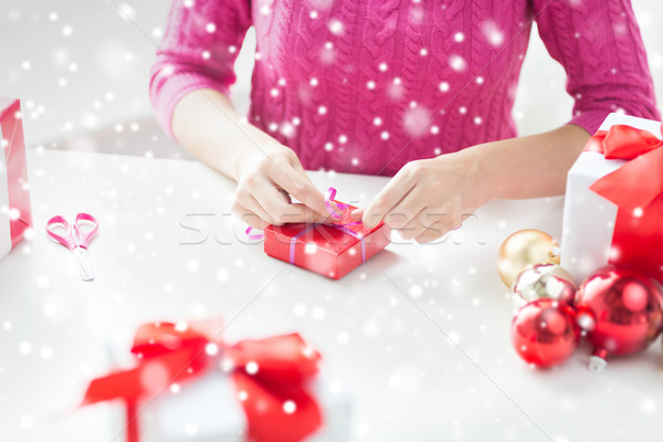 close up of woman decorating christmas presents Stock photo © dolgachov