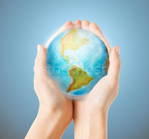 close up of human hands with earth globe Stock photo © dolgachov