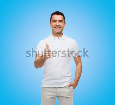 smiling man in t-shirt pointing finger on himself Stock photo © dolgachov