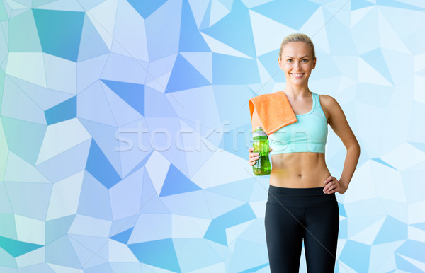 woman with bottle of water and towel Stock photo © dolgachov