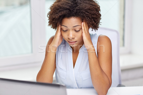 african woman with laptop at office Stock photo © dolgachov