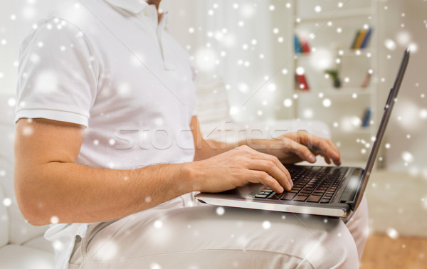 close up of man working with laptop at home Stock photo © dolgachov