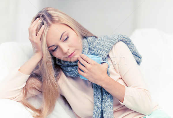 diseased woman with cup of tea Stock photo © dolgachov
