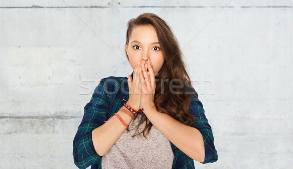 scared teenage girl over gray stone wall Stock photo © dolgachov