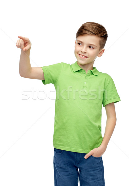 happy boy in green polo t-shirt pointing finger up Stock photo © dolgachov
