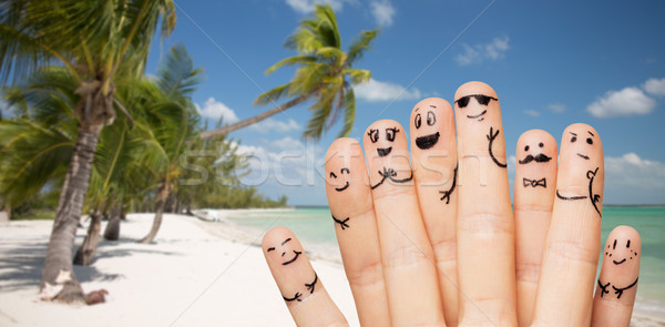 Közelkép ujjak emotikon arcok tengerpart utazás Stock fotó © dolgachov