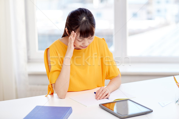 tired asian woman student with tablet pc at home Stock photo © dolgachov