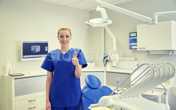 Heureux Homme dentiste clinique [[stock_photo]] © dolgachov