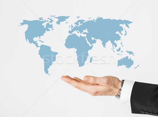 close up of businessman hand showing world map Stock photo © dolgachov