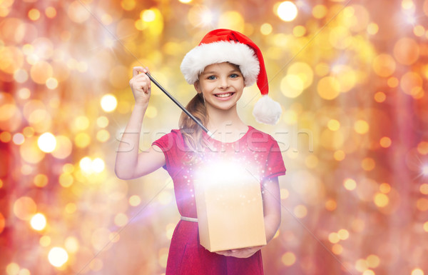 Lány mikulás kalap ajándék doboz varázspálca karácsony Stock fotó © dolgachov