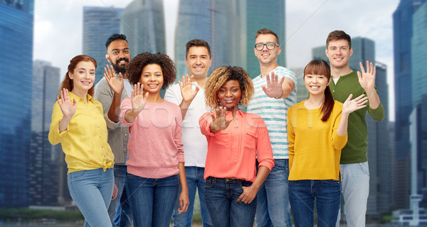 international group of happy people waving hand Stock photo © dolgachov