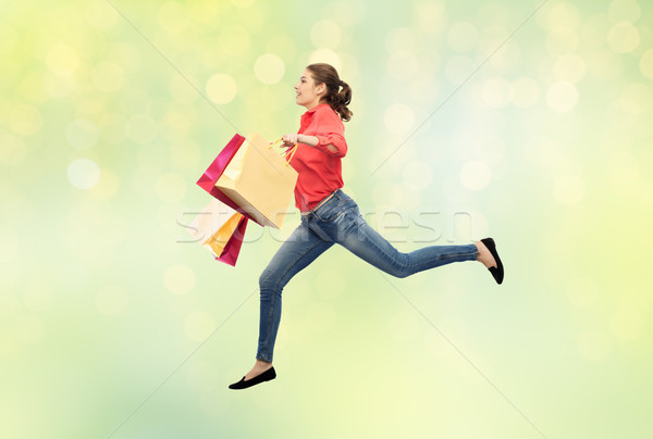 Stockfoto: Glimlachend · jonge · vrouw · springen · verkoop · beweging