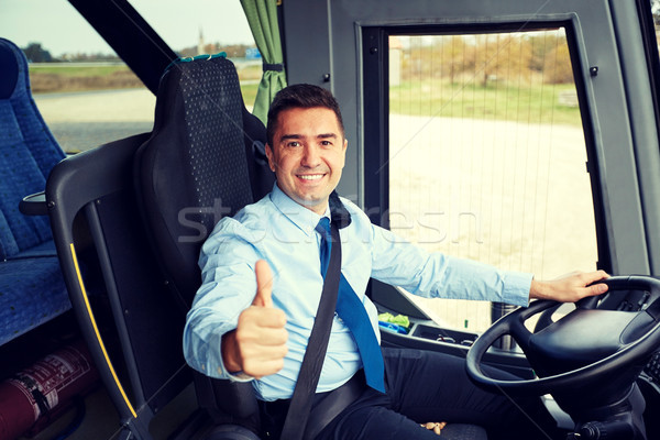 happy driver driving bus and snowing thumbs up Stock photo © dolgachov