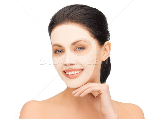beautiful young woman with collagen facial mask Stock photo © dolgachov