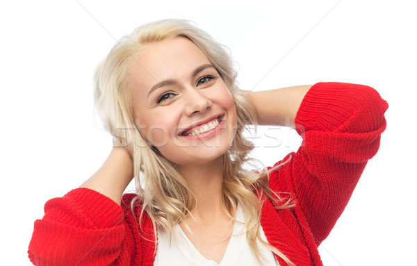 happy smiling young woman in red cardigan Stock photo © dolgachov