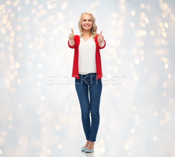 happy smiling young woman showing thumbs up Stock photo © dolgachov