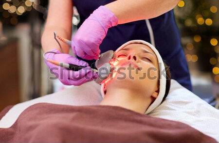 woman having microdermabrasion facial treatment Stock photo © dolgachov