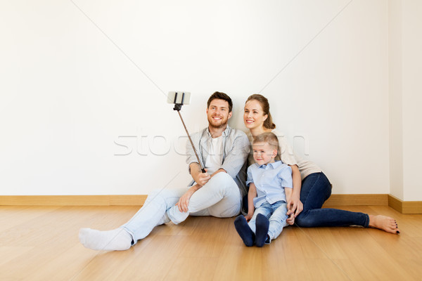 family taking selfie by smartphone at new home Stock photo © dolgachov