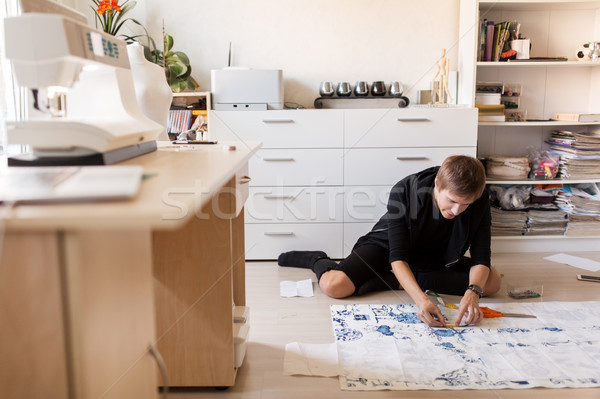 Stock photo: fashion designer making dress at sewing studio