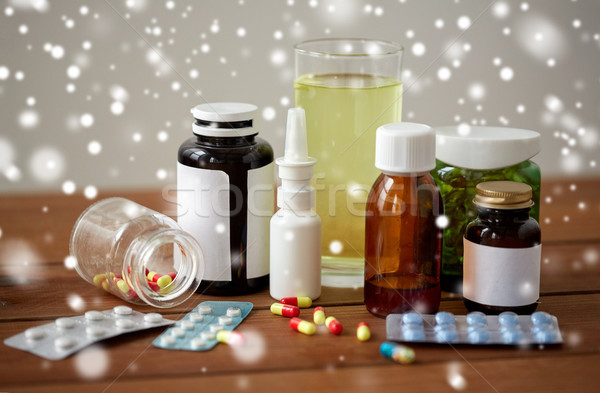 medicine and drugs on wooden table Stock photo © dolgachov