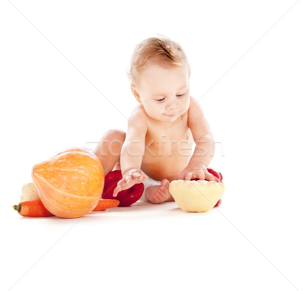 baby boy with vegetables Stock photo © dolgachov