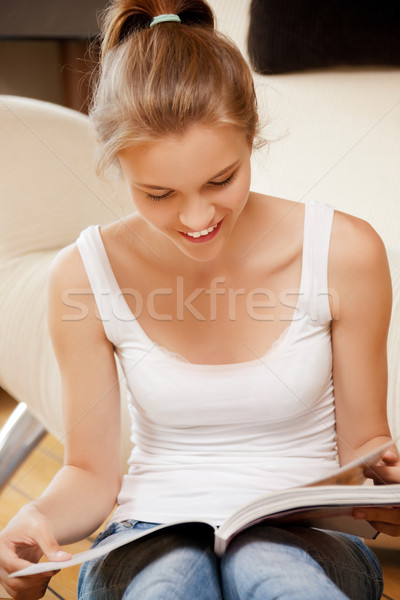 happy and smiling teenage girl with magazine Stock photo © dolgachov