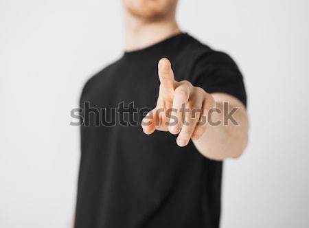 Człowiek środkowy palec czarny Zdjęcia stock © dolgachov