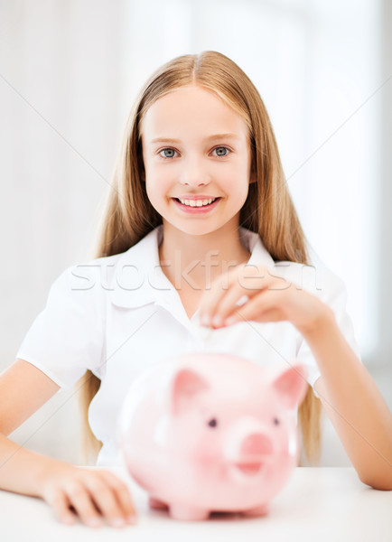 Stock photo: child with piggy bank