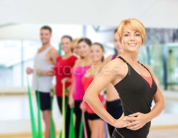 Groupe souriant personnes gymnase fitness [[stock_photo]] © dolgachov
