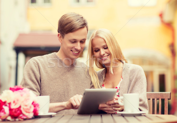 couple with tablet pc in cafe Stock photo © dolgachov
