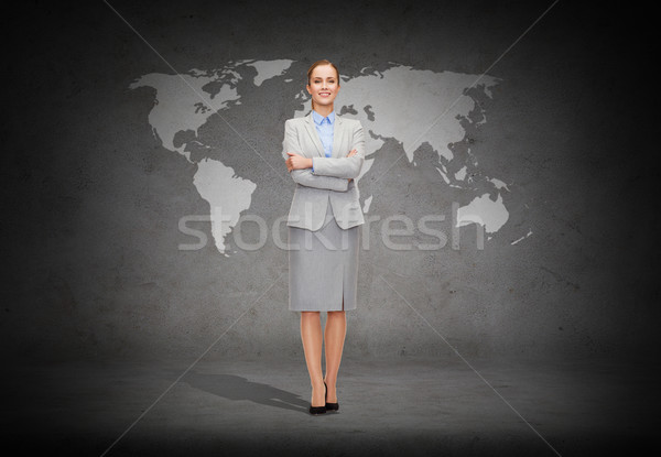young smiling businesswoman with crossed arms Stock photo © dolgachov