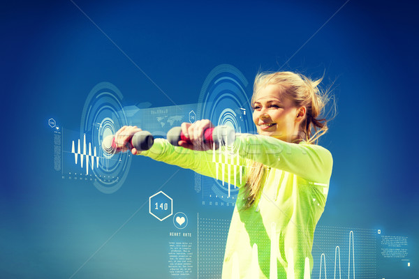 sporty woman with light dumbbells outdoors Stock photo © dolgachov