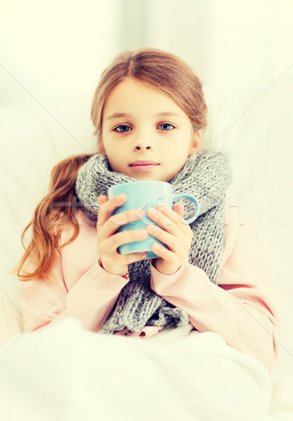 ill girl child with cup of hot tea Stock photo © dolgachov