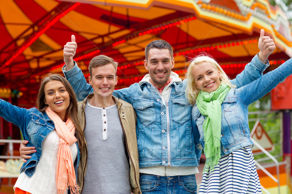 group of smiling friends showing thumbs up Stock photo © dolgachov