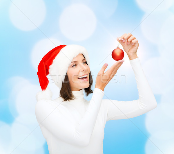 Stock photo: woman in santa helper hat with christmas ball