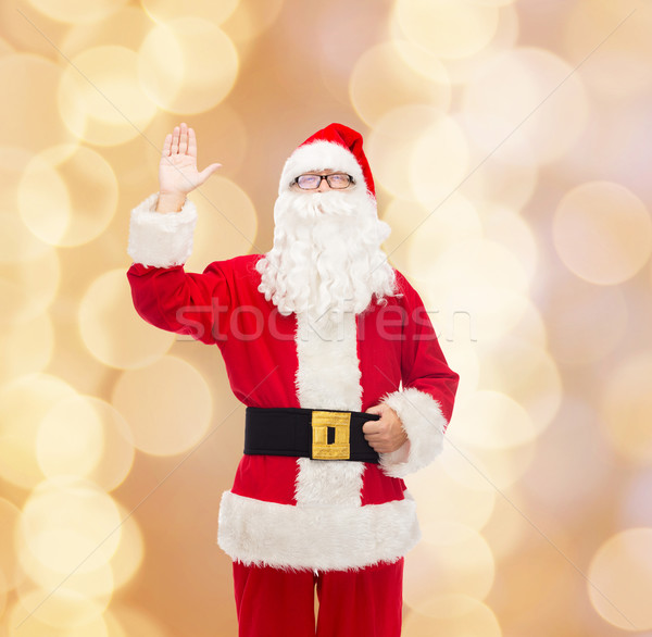 Homme costume Noël vacances geste [[stock_photo]] © dolgachov