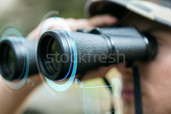 Stock photo: close up of soldier or hunter with binocular